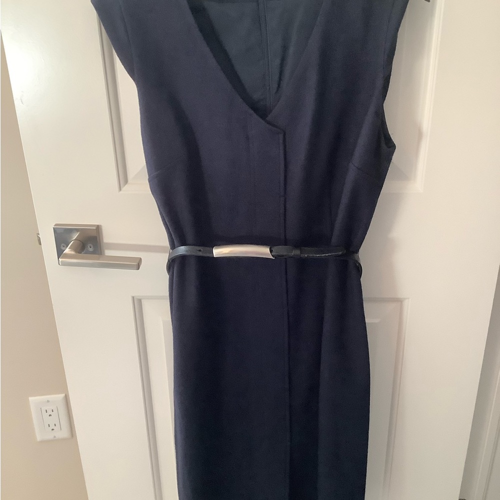 Navy business dress with leather and metal belt.
